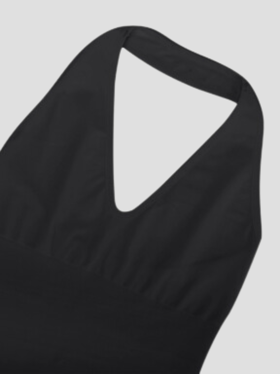 Closeup of the  halter neckline on a black shapewear bodysuit with built-in removable bra padding and a seamless thong design.