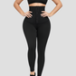 Woman wearing waist trainer leggings with a high corset-style closure in black.