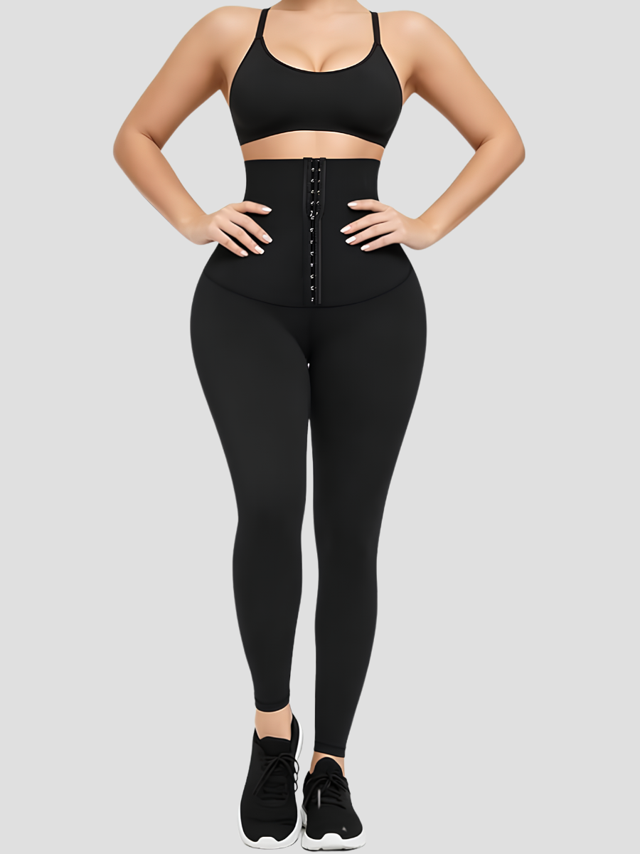 Woman wearing waist trainer leggings with a high corset-style closure in black.