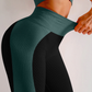Woman wearing high waisted black and teal patterned color block leggings with tummy control by BodyFlexx.
