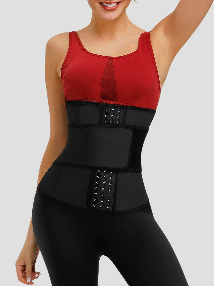 Woman wearing a black neoprene-lined sauna waist trainer with a 3-level front corset closure and a wide Velcro belt.