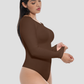 Woman wearing a brown long-sleeve tummy-control shapewear bodysuit top by BodyFlexx.