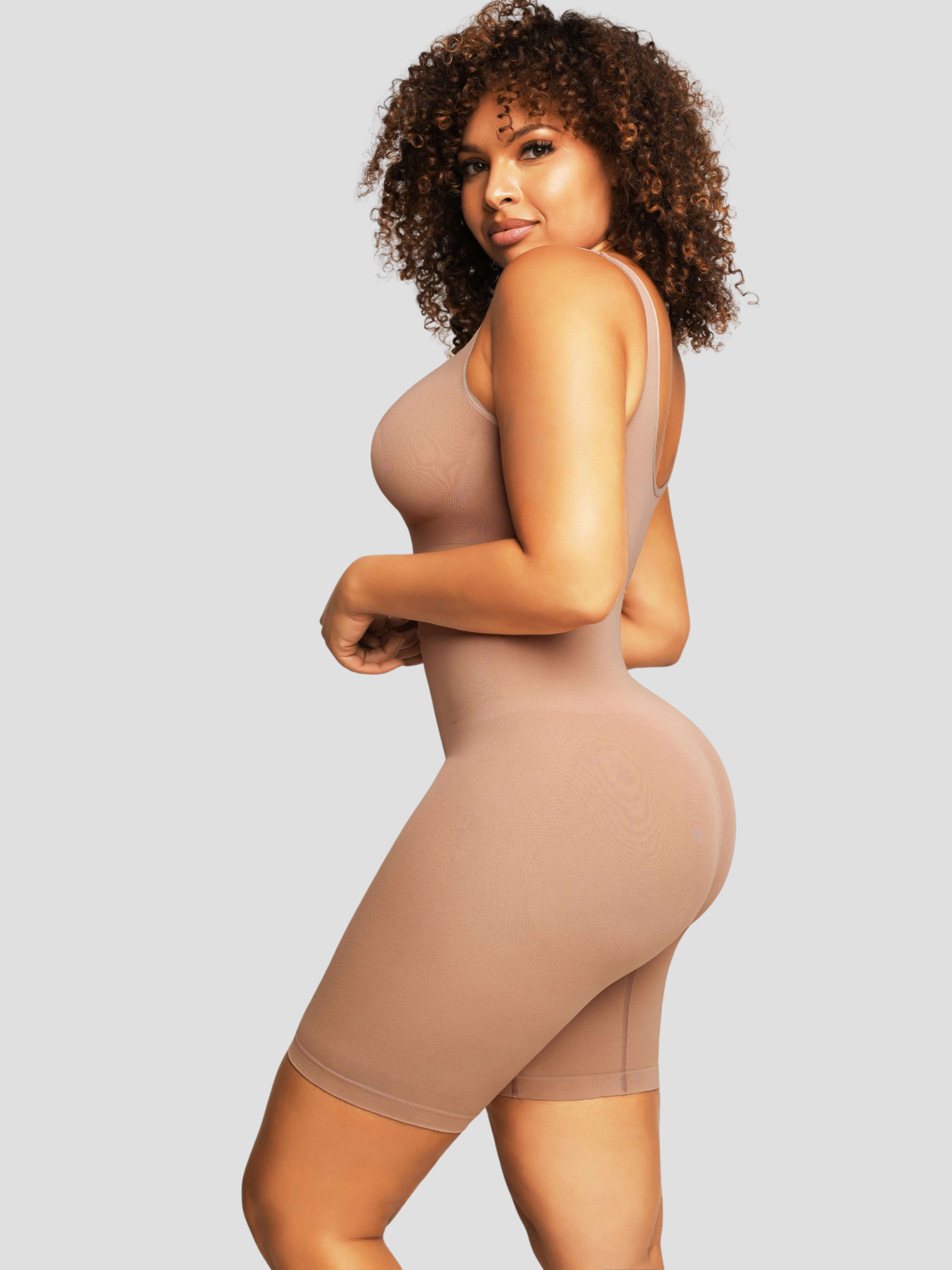 Model wearing a beige/nude colored mid-thigh shapewear bodysuit by BodyFlexx.