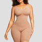 Woman wearing a beige/nude coloured mid-thigh shapewear bodysuit by BodyFlexx.