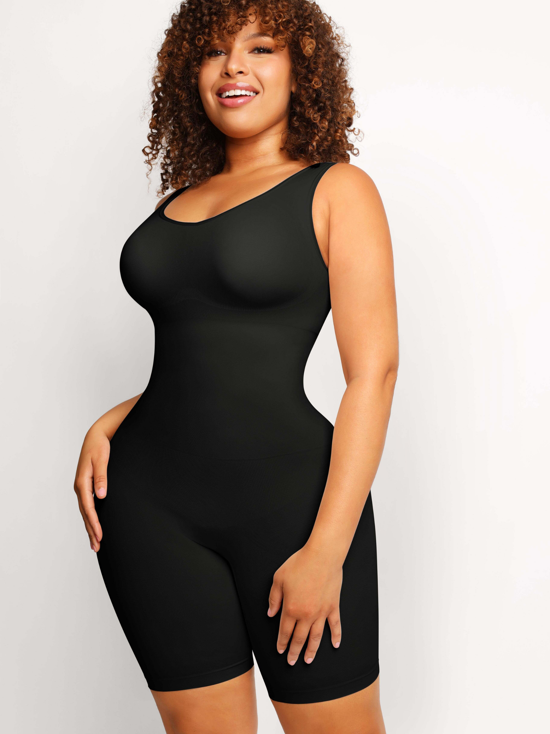 Woman wearing a black mid-thigh shapewear bodysuit designed by BodyFlexx.