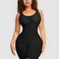 Curvy woman wearing a black mid-thigh shapewear bodysuit by BodyFlexx.