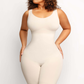 Woman wearing an ivory/white colored mid-thigh shapewear bodysuit by BodyFlexx flaunting her beautiful curvy figure.