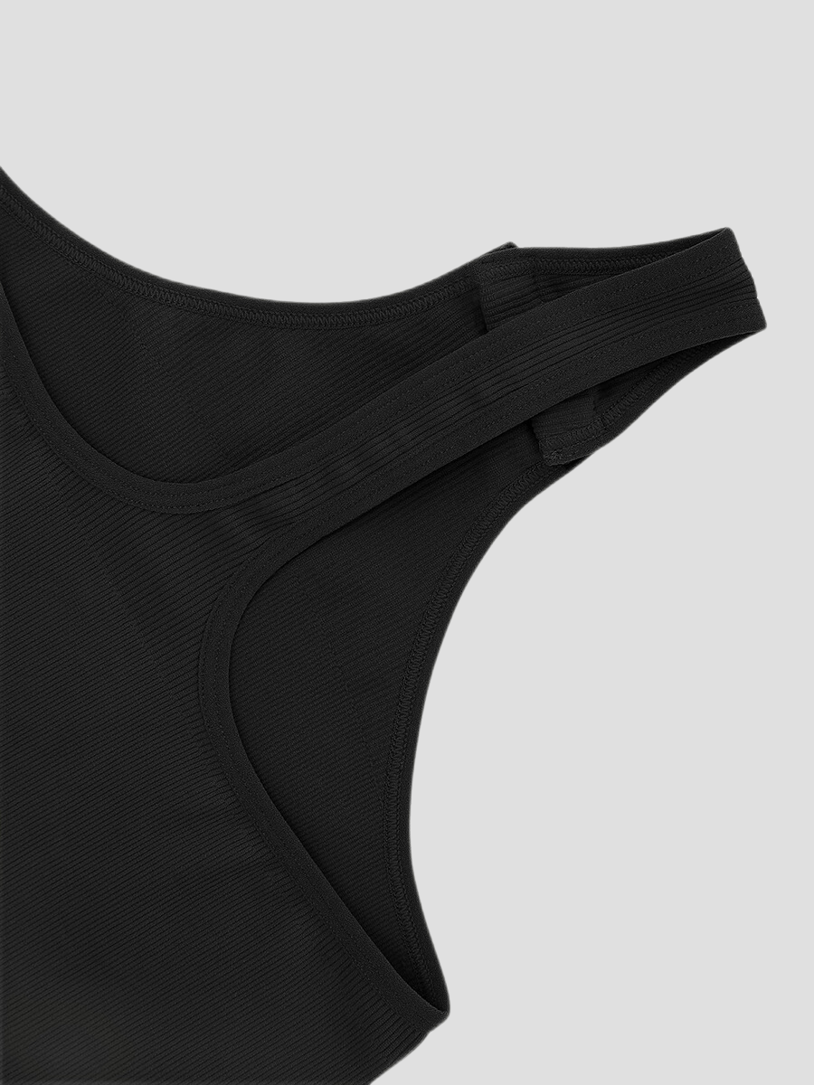 Closeup of a black off-the-shoulder shapewear bodysuit button snap crotch for bathroom convenience.