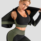 Woman wearing a black and green sports bra with matching leggings and jacket.