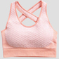 Padded pink textured sports bra with crisscross straps by BodyFlexx.