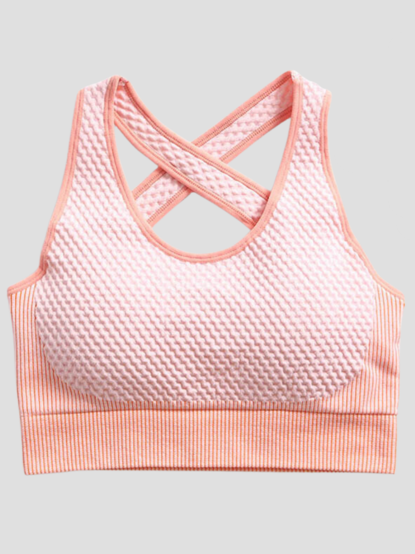 Padded pink textured sports bra with crisscross straps by BodyFlexx.