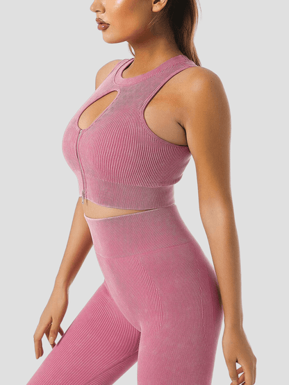Woman wearing a ribbed pink halter sports bra and matching leggings by BodyFlexx.