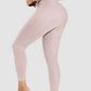 Woman posing in pink high waisted corset leggings for tummy-control and cellulite-smoothing by BodyFlexx Shapewear.
