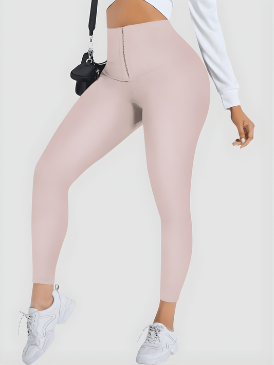 Woman wearing pink high waisted corset leggings for tummy-control and cellulite-smoothing by BodyFlexx Shapewear.