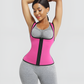 Woman wearing a waist training pink and black sauna activewear vest with her arms on her head on a light gray background.
