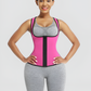 Woman wearing a pink and black waist trainer sauna top against a gray background.
