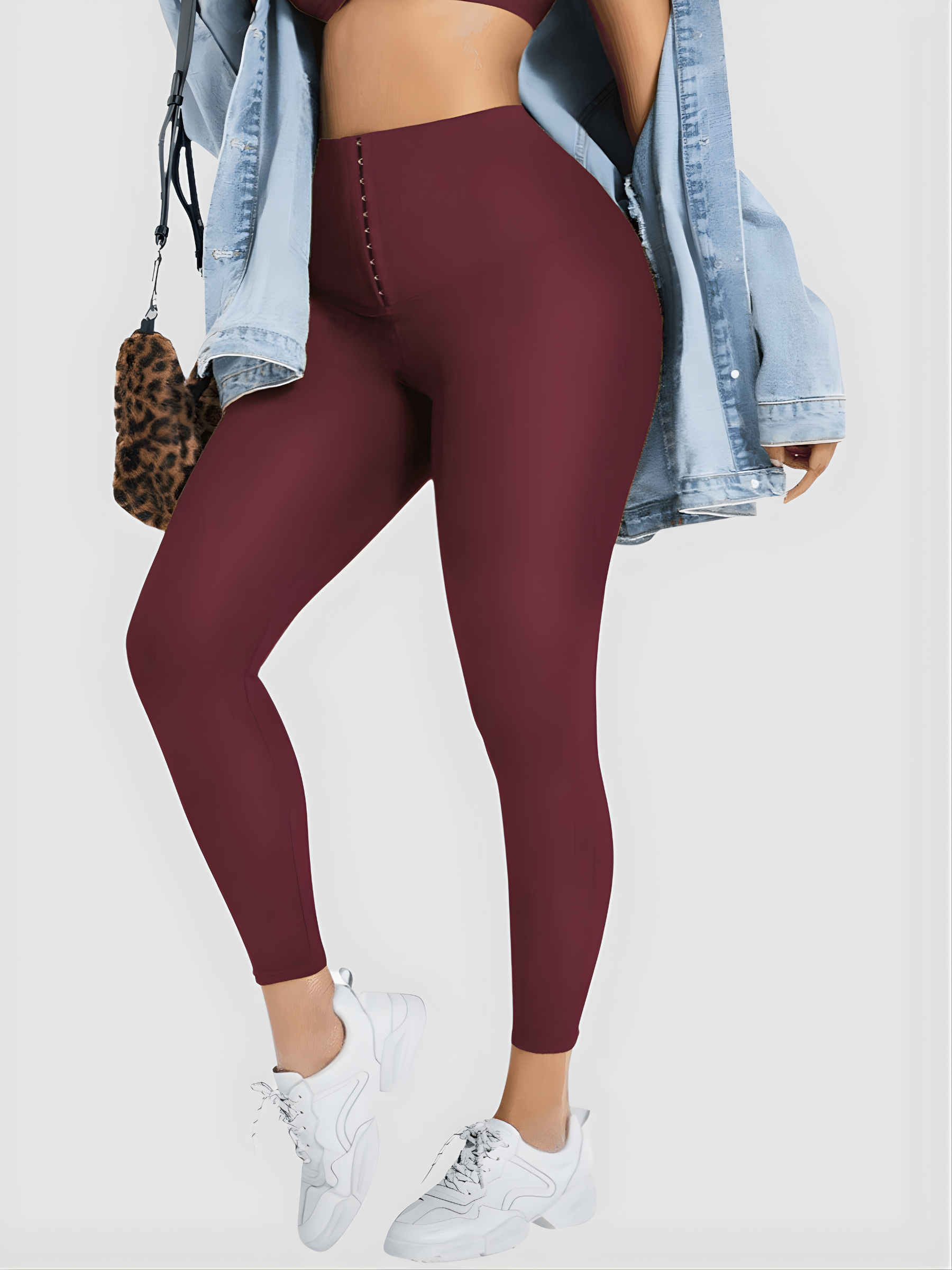 Woman wearing red waist training leggings by BodyFlexx Shapewear with a jean jacket.