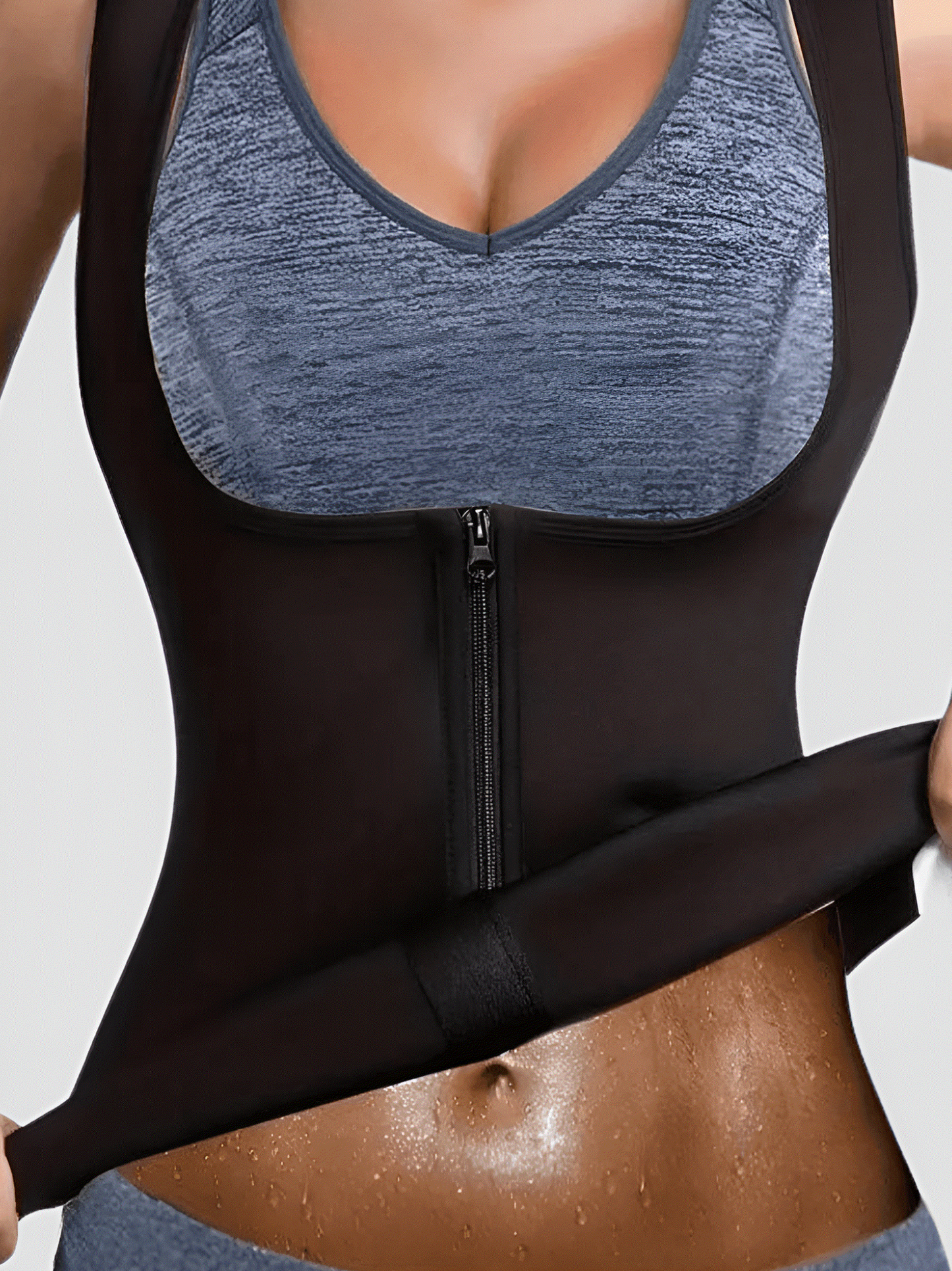 Person wearing a zippered neoprene-lined sauna activewear vest showing a very sweaty stomach after a workout.
