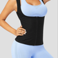 Woman wearing a black sauna activewear vest by BodyFlexx over a light blue activewear outfit after a workout.