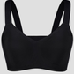 Close up of a wireless, seamless black t-shirt bra with wide adjustable straps and removable padding.