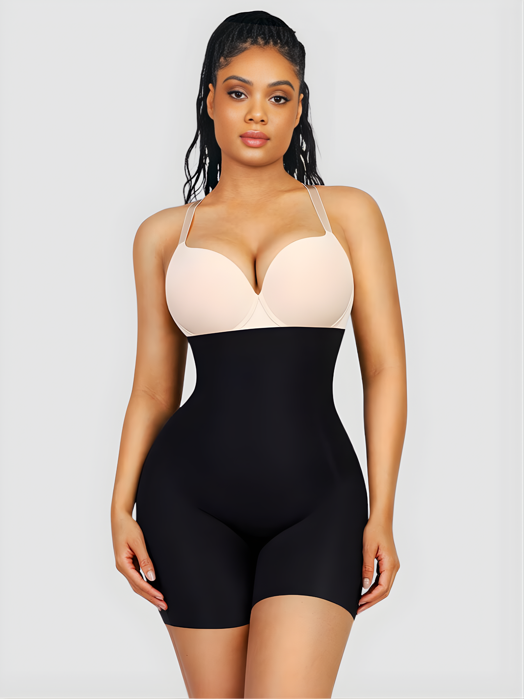 Woman wearing black high waisted shapewear bottoms with removable bum padding.