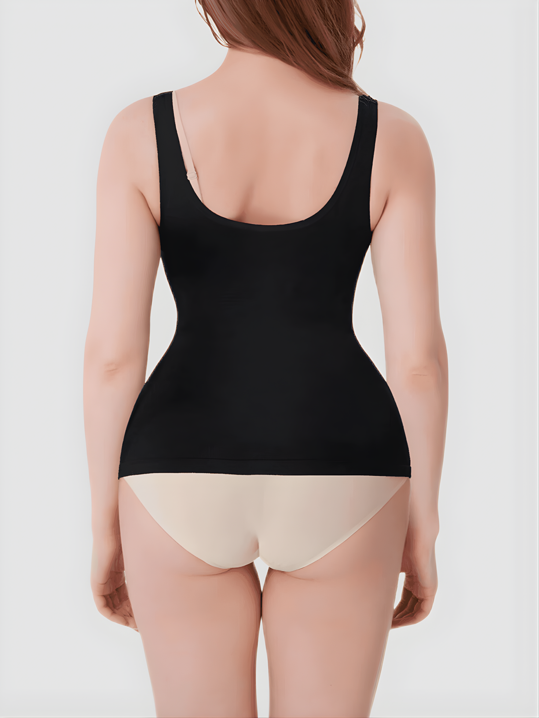 Woman wearing a black shaping tank top by BodyFlexx Shapewear and beige underwear.