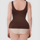 Woman wearing a brown shaping tank top by BodyFlexx Shapewear and beige underwear.
