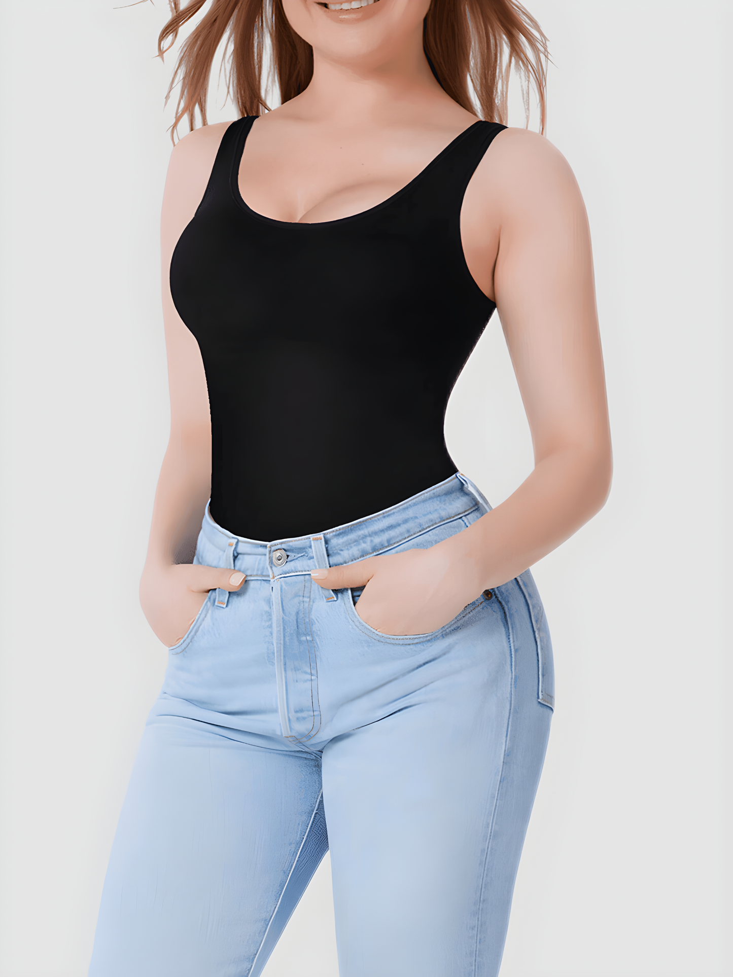 Woman wearing a black shaping tank top by BodyFlexx Shapewear with light blue jeans.