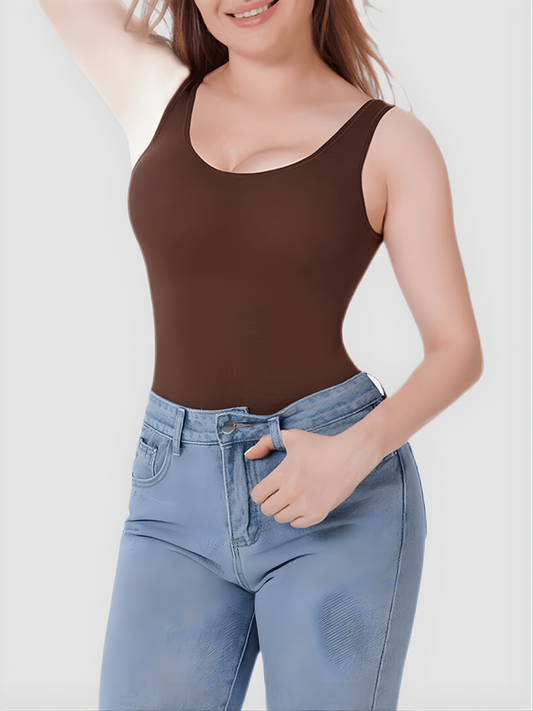 Woman wearing a brown shaping tank top by BodyFlexx Shapewear with light blue jeans.