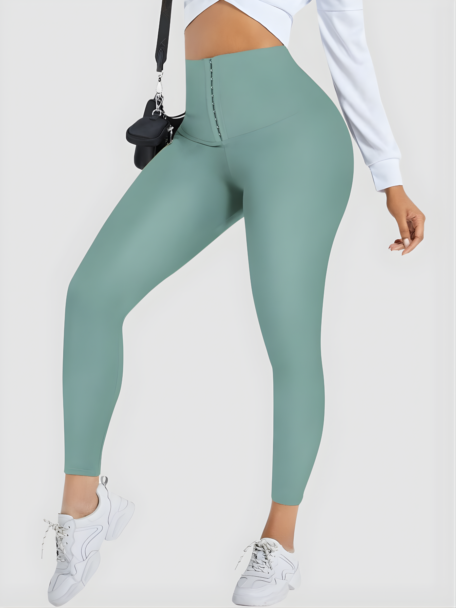 Woman wearing teal blue high waisted corset leggings for tummy-control and cellulite-smoothing by BodyFlexx Shapewear.