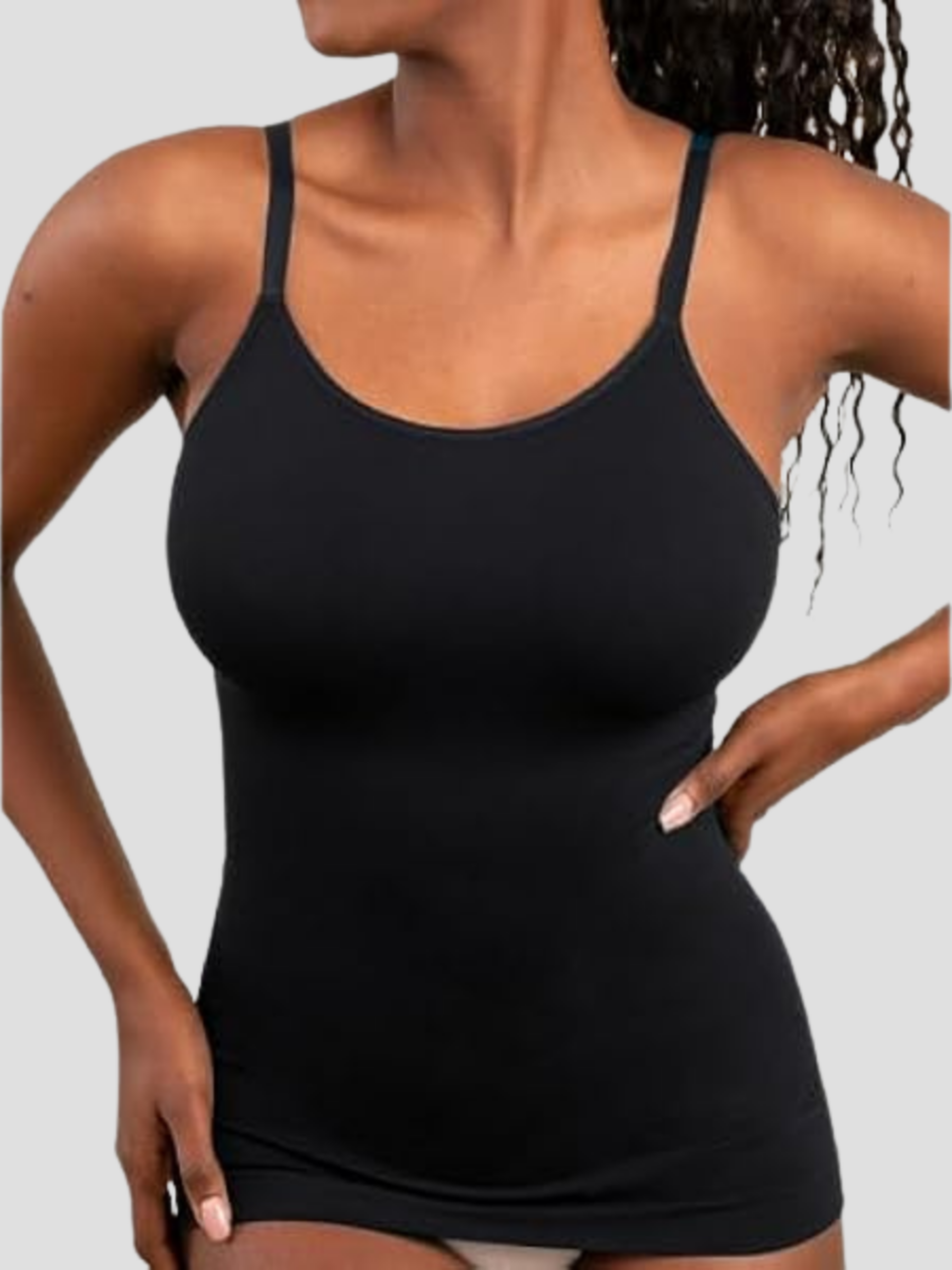Model wearing a black shapewear camisole with tummy control and adjustable straps.