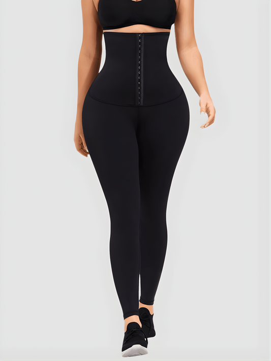 Woman wearing black waist training leggings with an extra high corset-style closure to flatten her tummy and sculpt her curves.