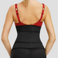 A  woman standing backwards wearing a black waist trainer and a red top showing how it is supporting her back.