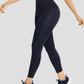 Woman walking in blue high waisted corset leggings for tummy-control and cellulite-smoothing by BodyFlexx Shapewear.