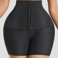 Woman wearing black Waist-Training Sauna Shorts with a corset closure by BodyFlexx.