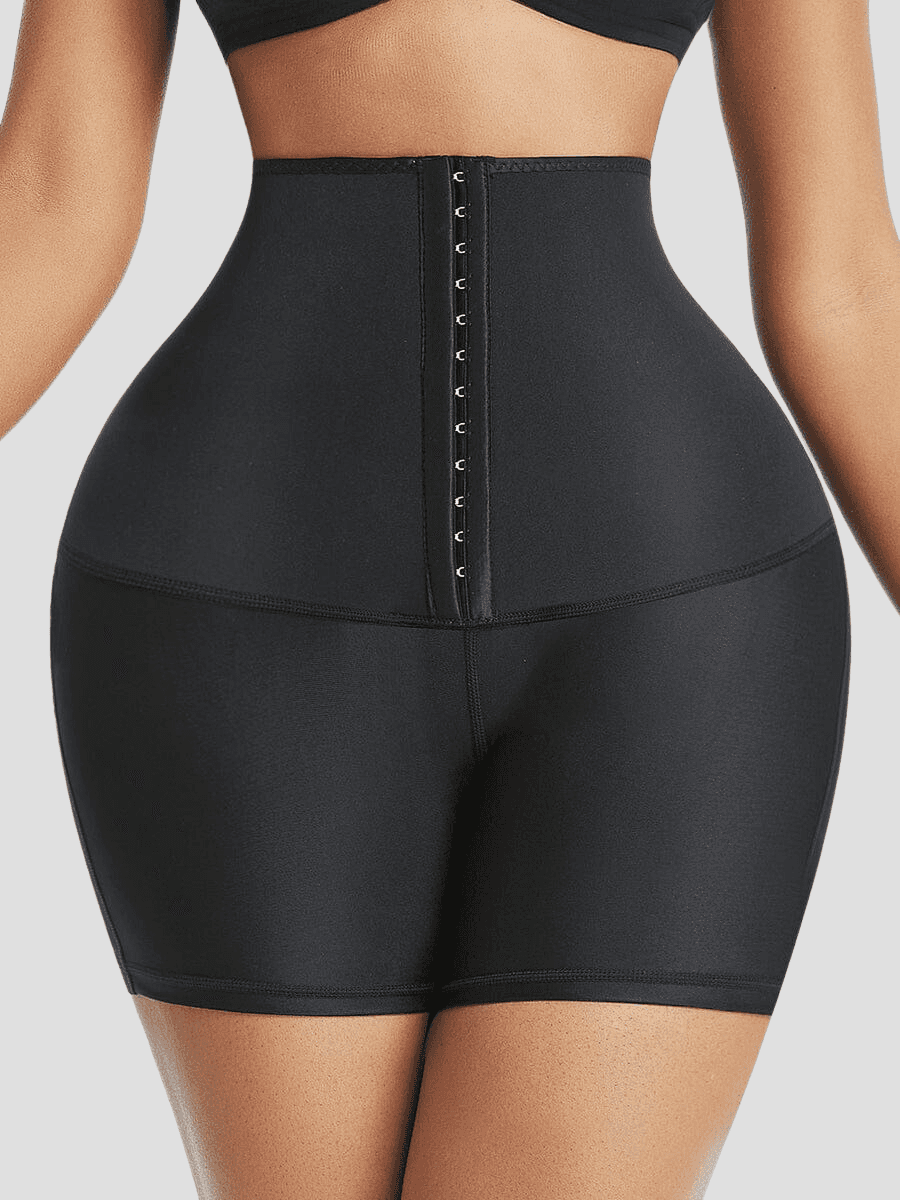 Woman wearing black Waist-Training Sauna Shorts with a corset closure by BodyFlexx.
