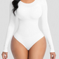 Woman wearing a white long-sleeve shaping bodysuit by BodyFlexx Shapewear.
