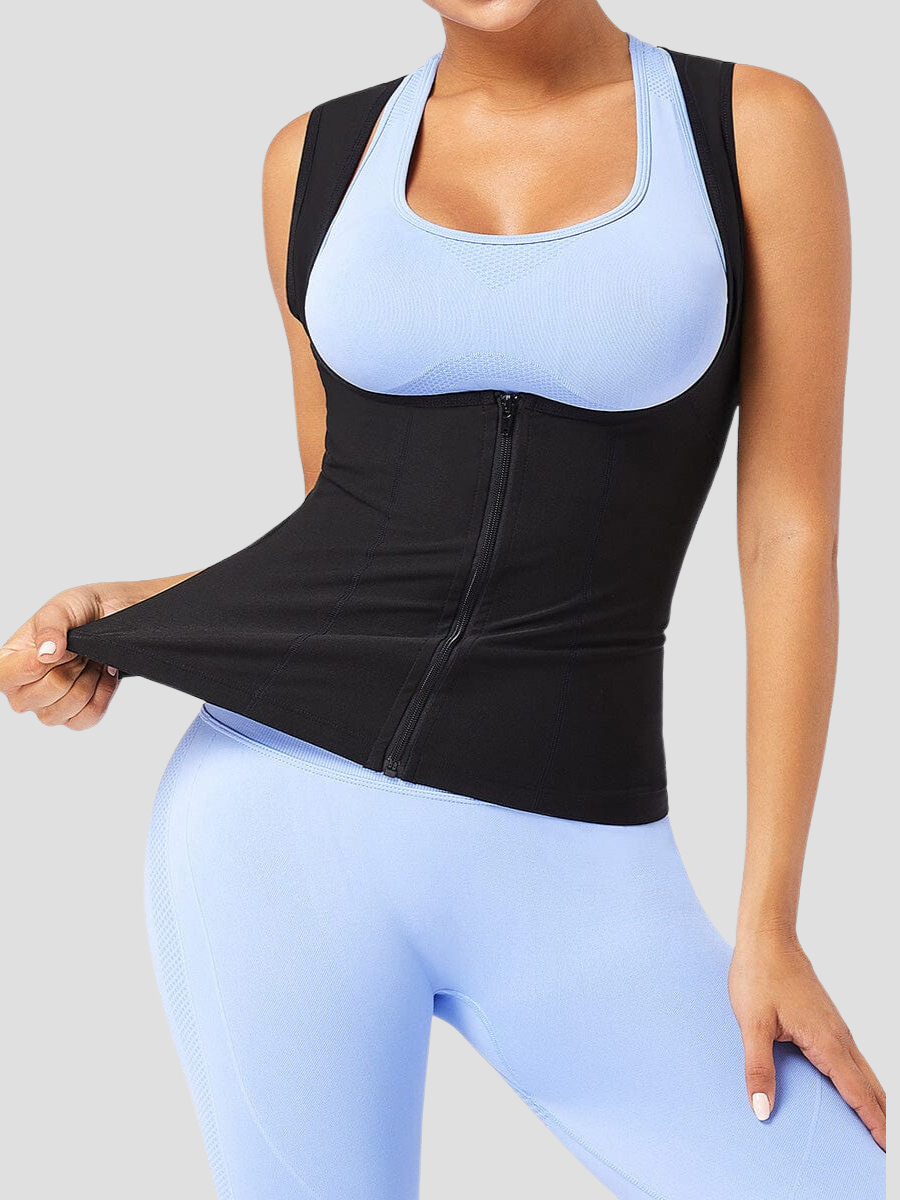 Woman wearing a neoprene-lined sauna vest by BodyFlexx over a blue activewear outfit.