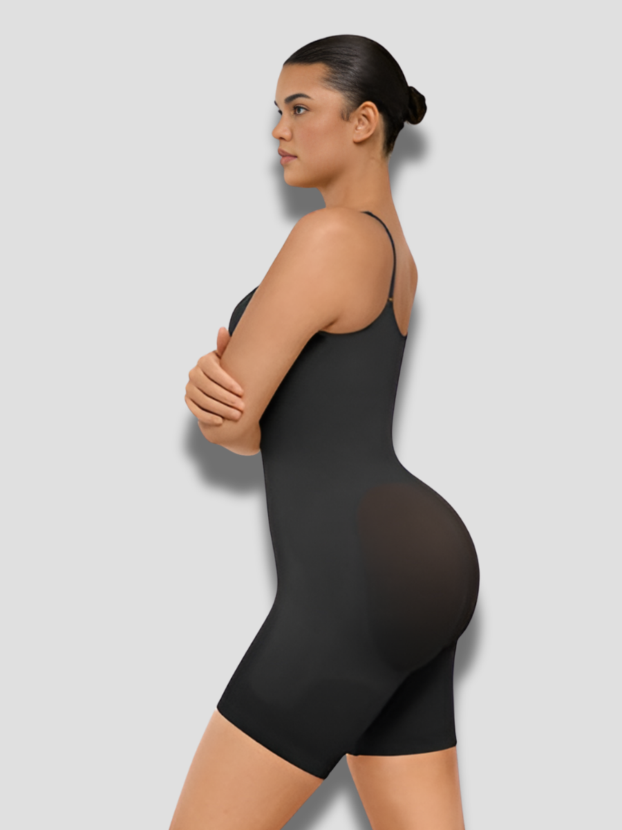 Woman wearing a black mid-thigh shapewear bodysuit with adjustable by BodyFlexx Shapewear.