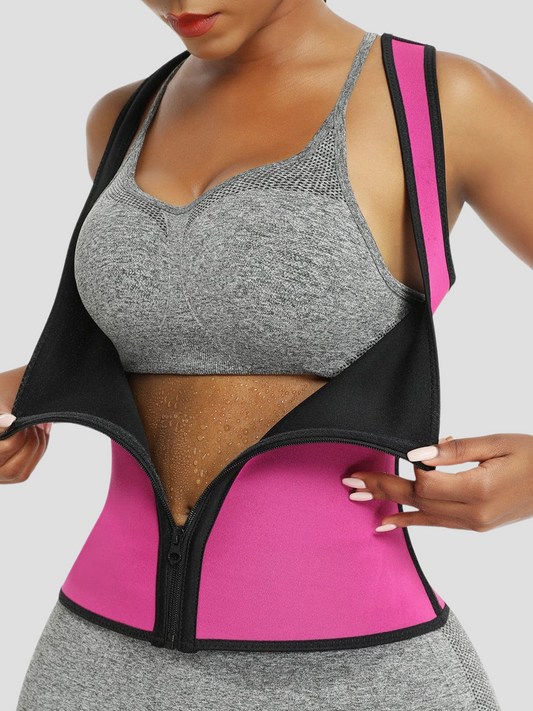 Sauna activewear vest being unzipped in the front by a woman showing her sweat covered stomach after working out. The vest is hot pink and black.